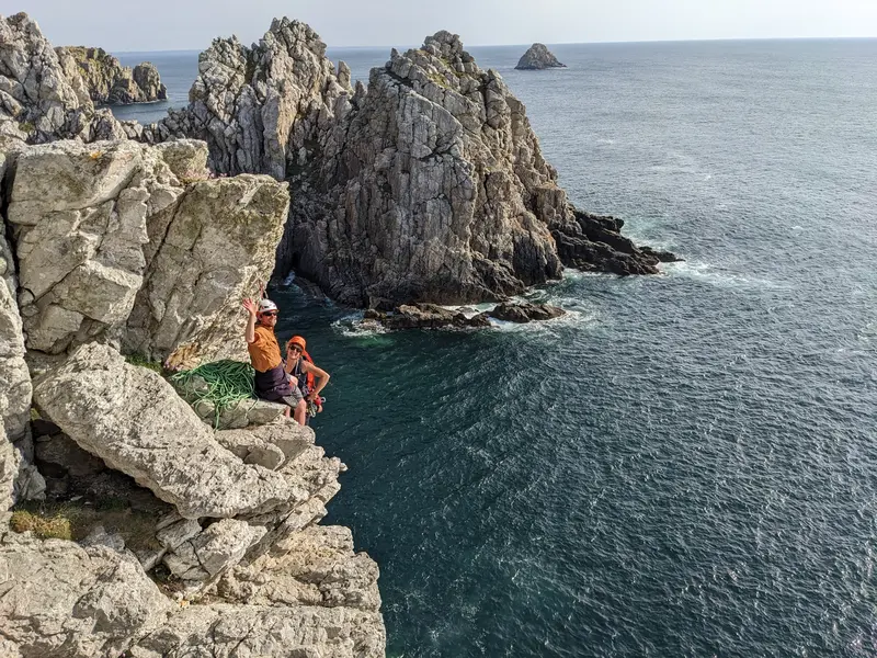 Two climbers on the cliffs above the sea at Pen-Hir.